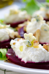 Beet Salad with goat cheese, walnuts, greens and herbs