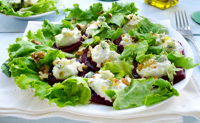 Beet Salad with goat cheese, walnuts, greens and herbs