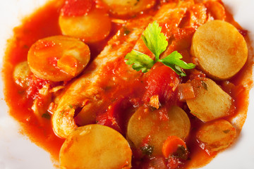 Fish stew in tomato sauce with patatoes
