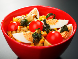 Salad with cherry tomato, eggs and corn