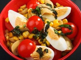 Salad with cherry tomato, eggs and corn