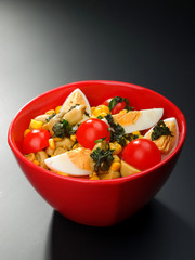 Salad with cherry tomato, eggs and corn