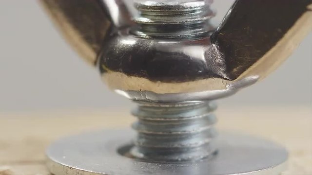 Hand Tightening a Wing Nut