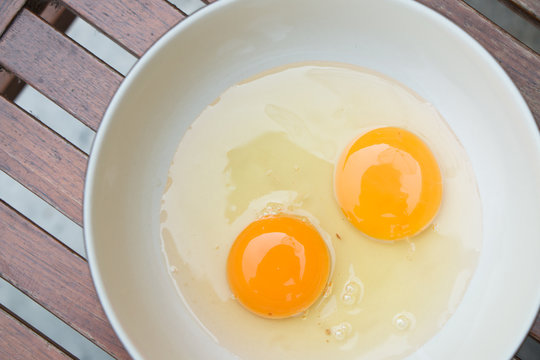 raw egg yolk on the dish on table
