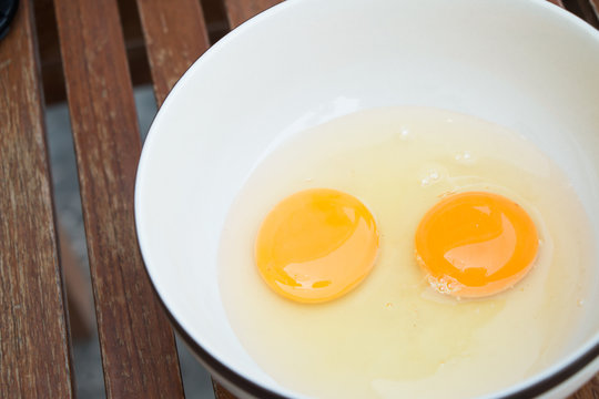 raw egg yolk on the dish on table