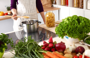 Cook's hands preparing vegetable salad - closeup shot