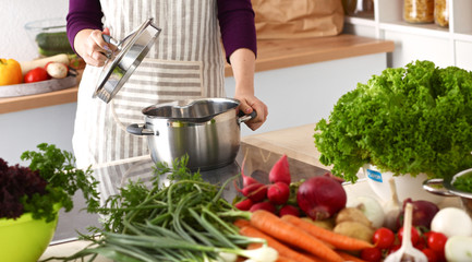 Cook's hands preparing vegetable salad - closeup shot