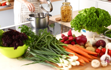 Cook's hands preparing vegetable salad - closeup shot