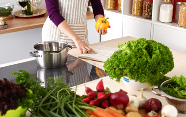 Cook's hands preparing vegetable salad - closeup shot