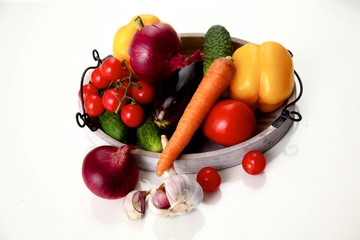 Composition with assorted raw organic vegetables wooden table