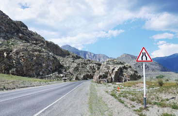 Mountain road passing among the rocks