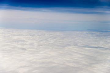 Fototapeta na wymiar clouds sky . view from the window of an airplane flying in the c