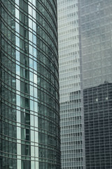 Fototapeta na wymiar light green glass wall builting - Modern Office Building in toky