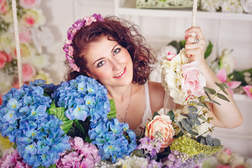 Attractive girl with flowers.