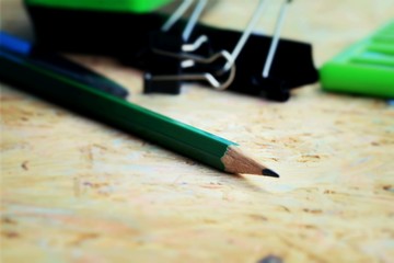 Mix book and calculator, stapler, tape, paper punch, pencil