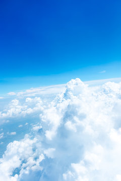 Aerial view of Blue sky and Cloud Top view from airplane window,