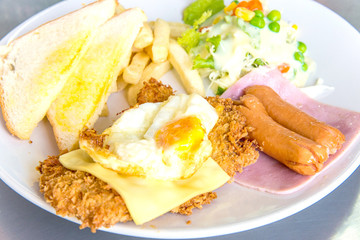 chicken fried steak with egg and sausage