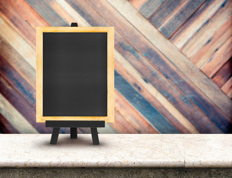 Blackboard menu with easel on marble table with blur diagonal wo