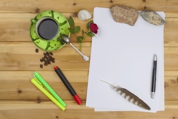 The writer writes a novel. Creating success stories. Pens in the office on a  table. Confession of love for Valentine's Day written on by hand on paper. Issues of love and hope. Place for your text.
