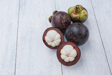 Mangosteen on wood background