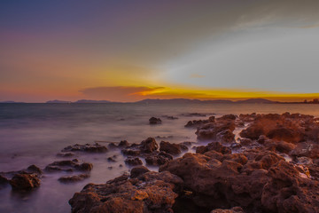 Fototapeta premium Rocky beach at sunset