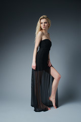 Fototapeta premium beautiful fashionable woman in black dress