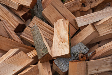 Chopped firewood logs as an abstract background