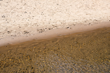 Stones under river, with water effect over them