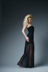 Fototapeta premium beautiful fashionable woman in black dress