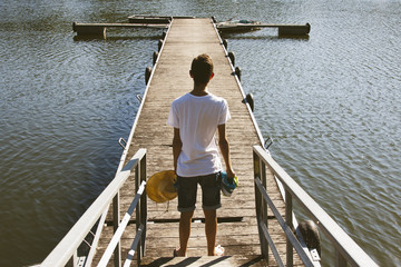 young teen boy on the pier
