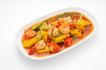 Fried shrimps with pineapple in sweet sauce isolated on white