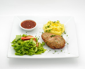 Russian traditional cutlet with mashed potatoes isolated on white
