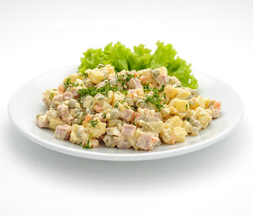 Olivie salad with mayonaisse isolated on white