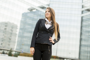 Business woman in front of office building