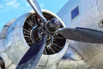 the propeller with  engine on wing of old aircraft - obrazy, fototapety, plakaty