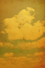 Blue sky with clouds in grunge and retro style.