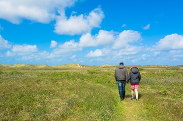 Fototapeta na wymiar Young couple walking on Island Rømø