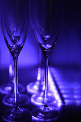 champagne glasses in purple backlight