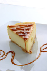 cheese cake with caramel sauce isolated