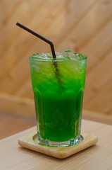 A glass of kiwi soda