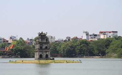 Fototapeta na wymiar Turtle Tower in center of the Hoan Kiem lake