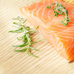 Raw salmon on cutting board