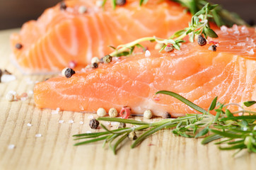 Raw salmon on cutting board