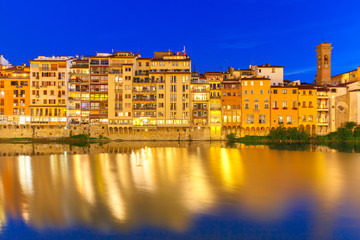 Fototapeta na wymiar Embankment of river Arno at night, Florence, Italy