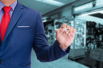 business man use pen writing on virtual screen