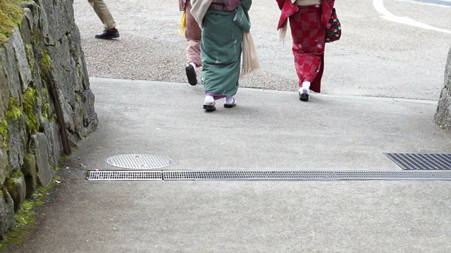 Japanese girls wear kimono parasol and geta Japan sandal footwear