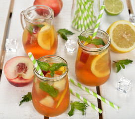 Ice tea with lemon, peach and mint