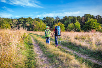 Fototapeta na wymiar Two traveling kids with backpacks