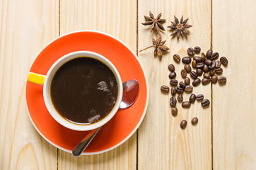 coffee cup and roast coffee in sack on wood table