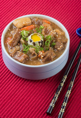 japanese cuisine. beef soup on the background